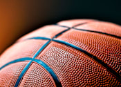 Thumbnail 4 of 8 - A close up of a basketball with a focus on the textured surface and the blue lines.