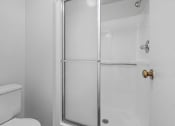 Thumbnail 14 of 28 - a bathroom with a shower and a toilet