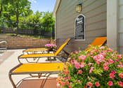 Thumbnail 21 of 28 - a patio with benches by the pool