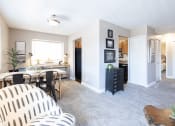 Thumbnail 3 of 17 - a living room with a dining room and a kitchen