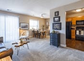 Thumbnail 2 of 17 - the view of a living room with a dining room and a kitchen