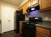 Thumbnail 3 of 28 - Kitchen at Woods of Post House Apartments in Jackson, TN
