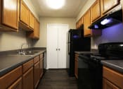 Thumbnail 4 of 28 - Kitchen at Woods of Post House Apartments in Jackson, TN