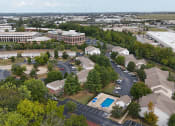 Thumbnail 6 of 14 - aerial view of apartments with shade trees