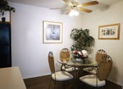 Thumbnail 3 of 14 - dining room in apartment with a table and a ceiling fan