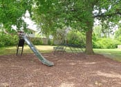Thumbnail 13 of 14 - playground at apartment community