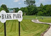 Thumbnail 12 of 14 - a park with a sign that reads bark park