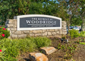 Thumbnail 21 of 22 - Welcome sign for The Retreat at Woodridge Apartments