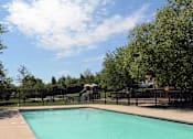 Thumbnail 14 of 15 - A small pool surrounded by a black fence.