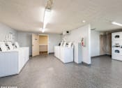 Thumbnail 8 of 15 - laundry room with washer and dryer machines