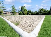 Thumbnail 11 of 15 - a sand volleyball court