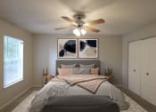 Thumbnail 5 of 22 - a bedroom with a ceiling fan and a bed