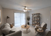 Thumbnail 4 of 22 - an open living room with a ceiling fan and a window