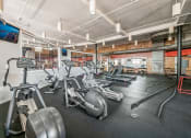 Thumbnail 5 of 19 - Apartment Fitness Center with Cardio Machines