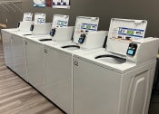 Thumbnail 9 of 19 - Laundry Facility in Apartment Building