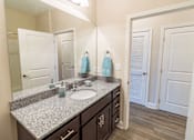 Thumbnail 7 of 22 - apartment bathroom with a sink and mirror