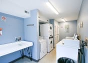 Thumbnail 4 of 14 - a laundry room with a washer and dryer