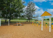 Thumbnail 8 of 14 - a playground with a picnic table and a basketball hoop