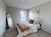 Thumbnail 10 of 31 - A bedroom with a bed, pillows, and a mirror.