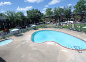 Thumbnail 8 of 16 - outdoor pool at apartment complex