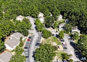 Thumbnail 12 of 16 - A bird's eye view of a residential area with houses and cars.