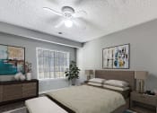 Thumbnail 5 of 11 - a bedroom with a bed and a ceiling fan