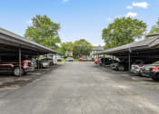 Thumbnail 10 of 18 - a parking lot with carports