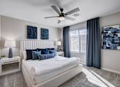 Thumbnail 14 of 93 - Bedroom With Ceiling Fan at Copper Creek Apartments, Nevada 