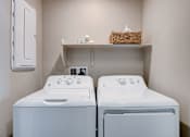 Thumbnail 73 of 93 - A small laundry room with a washer and dryer.at Copper Creek Apartments, Las Vegas, 89123