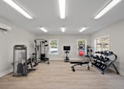 Thumbnail 32 of 39 - A spacious home gym with a variety of exercise equipment.