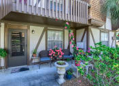 Thumbnail 20 of 20 - the front porch of a house with chairs and potted plants