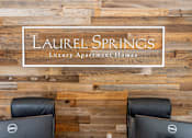 Thumbnail 9 of 24 - a sign that reads laurel springs luxury apartment homes