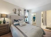 Thumbnail 17 of 29 - our apartments offer a bedroom with a large bed and a walk in closet