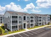 Thumbnail 24 of 42 - Apartment building with a parking lot in front.