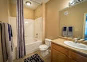 Thumbnail 21 of 21 - a bathroom with a sink toilet and a bath tub