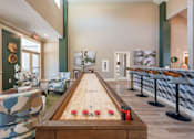 Thumbnail 3 of 54 - A room with a pool table and chairs.
