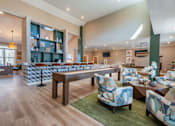 Thumbnail 13 of 52 - A large room with a long table and chairs.