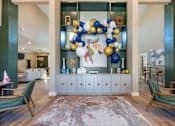 Thumbnail 18 of 54 - A room with a large wreath and a rug on the floor.