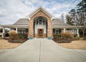 Thumbnail 12 of 21 - the front of a house with a walkway and a front door