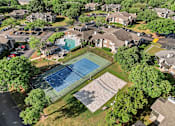 Thumbnail 31 of 33 - ariel photo of tennis courts and sparkling swimming pool