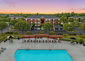 Thumbnail 4 of 24 - an aerial view of a swimming pool with a hotel in the background