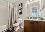 Thumbnail 18 of 33 - spacious bathroom with tub and shower, toilet, and sink