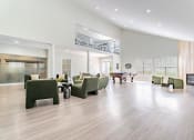 Thumbnail 20 of 40 - a large living room with furniture and a pool table