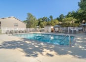 Thumbnail 22 of 35 - our resort style pool is surrounded by a fence and trees