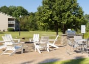 Thumbnail 30 of 35 - a patio with chairs and tables on a lawn
