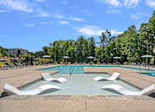 Thumbnail 4 of 52 - A swimming pool with a person diving into the water.
