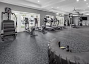Thumbnail 8 of 27 - Fitness Center with a tire in the foreground and fitness equipment in the background.