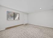 Thumbnail 35 of 52 - Open room with a carpeted floor and a window with blinds.