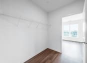 Thumbnail 27 of 34 - an empty room with white walls and a window