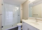 Thumbnail 40 of 41 - a bathroom with a shower toilet and sink